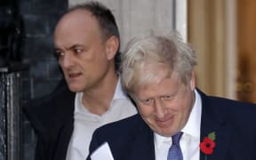 Britain's Prime Minister Boris Johnson (R) and Number 10 special advisor Dominic Cummings leave from 10 Downing Street in central London on October 28, 2019.