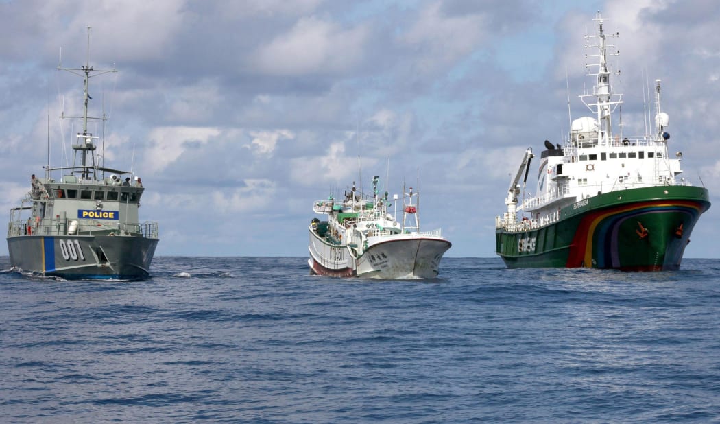 A Palauan law enforcement vessel escorting a Taiwanese long line fishing vessel suspected of illegally shark finning in 2011.