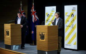 WELLINGTON, NEW ZEALAND - SEPTEMBER 05: Deputy Prime Minister Grant Robertson (L) and Director-General of Health Dr Ashley Bloomfield address media during a press conference at Parliament on September 05, 2021 in Wellington,