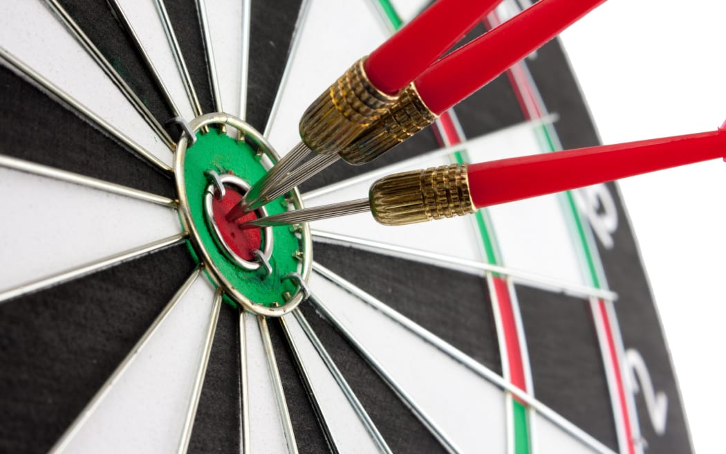 Darts in a dartboard.