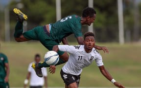 Vanuatu's Joseph Iaruel collides with Fiji's Tito Vodowaqa