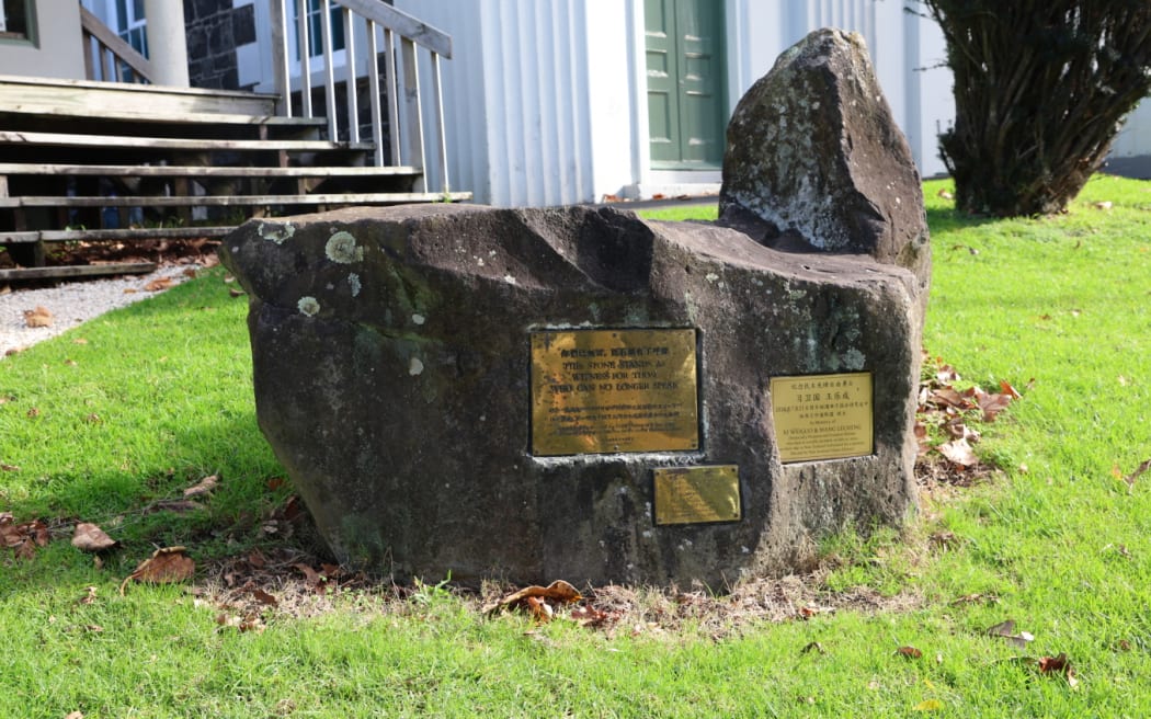 From NZ History: The Tiananmen Square memorial boulder, dedicated to the victims of the Tiananmen Square massacre, was unveiled on the Alten Road frontage of St Andrews Presbyterian Church on 17 September 1989. The event was organized by two Chinese poets in exile, Yang Lian and Chu Geng, who had been in New Zealand at the time of the massacre, The stone represents the geographical shape of China. The plaque has texts in both Mandarin and English.