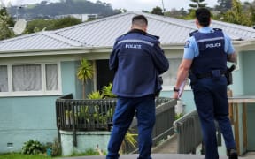Police guard a house on Tuarangi Rd following a fatal shooting in September 2024.