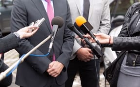 Journalists making media interview with businessperson or politician