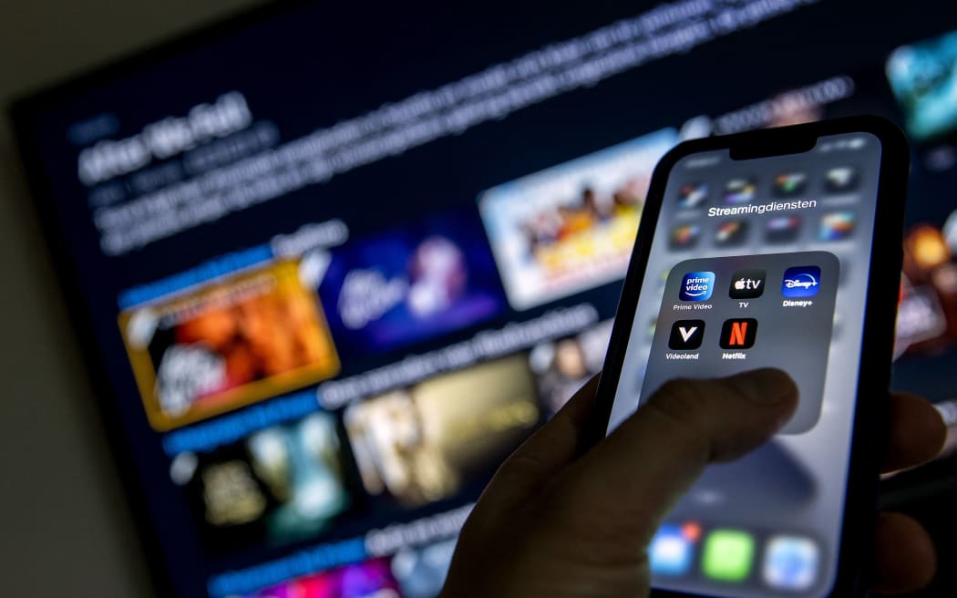 2022-01-19 12:42:43 ILLUSTRATIVE - Applications from streaming services Disney Plus, Amazon Prime Video, Apple TV, Videoland and Netflix on a phone. KOEN VAN WEEL (Photo by Koen van Weel / ANP MAG / ANP via AFP)