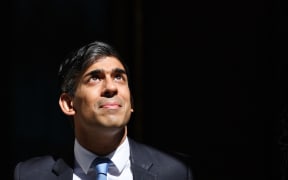 Britain's Prime Minister Rishi Sunak reacts as he leaves 10 Downing Street in central London on May 8, 2024 to take part in the weekly session of Prime Minister's Questions (PMQs) in the House of Commons. (Photo by Adrian DENNIS / AFP)