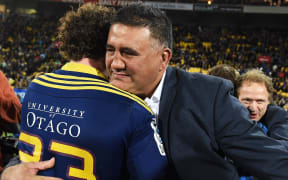 Jamie Joseph embraces Marty Banks after winning the Super Rugby title.