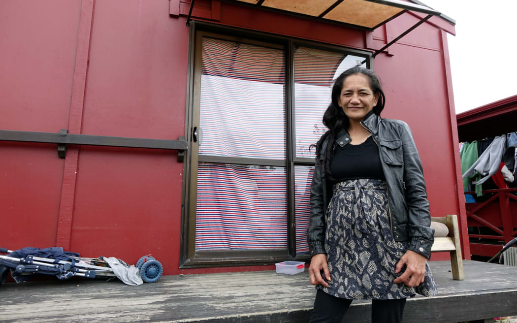 Mandy stands outside her home at Western Park Village in West Auckland.