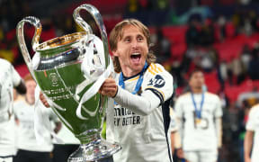 Luka Modric of Real Madrid celebrates with the UEFA Champions League Trophy