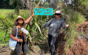 Tararata Stream team’s Pragna Patel and Julia Tu’ineau next to the felled trees