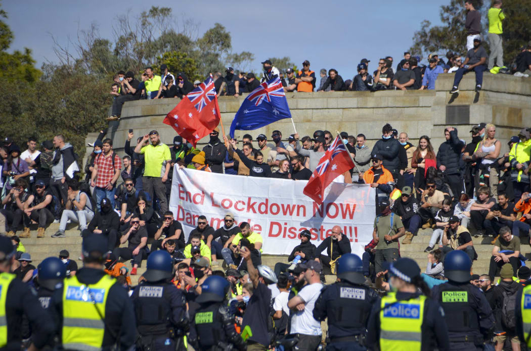 Hundreds of anti-lockdown protesters clashed with police in Melbourne, leaving at least four people injured and more than 200 arrested.