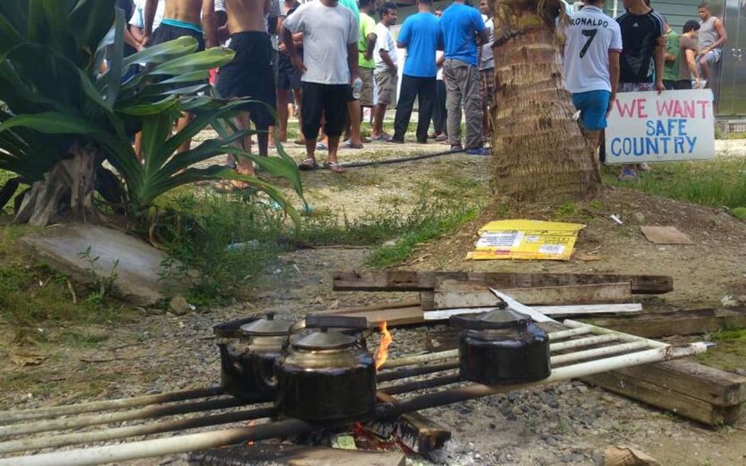 Refugees boiling rainwater.