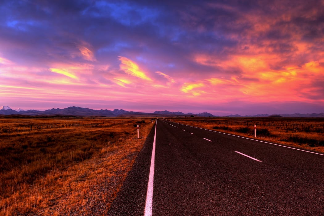 empty country road at sunset