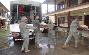 Food been delivered to an evacuation centre in Fiji.