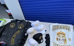 Items of clothing emblazoned with the Killer Beez gang logo.