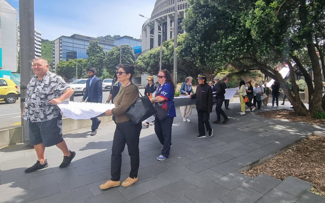 A petition containing 90,000 signatures - calling on the government to fix a broken health system - is presented to Parliament
