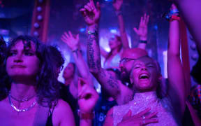 Party goers dance in The Salon Carousel venue in the Unfairground area on the fifth day of the Glastonbury.