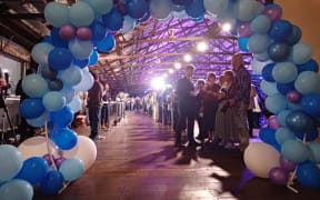 An archway of balloons awaits Christopher Luxon at the National event at Shed 10 in Auckland.