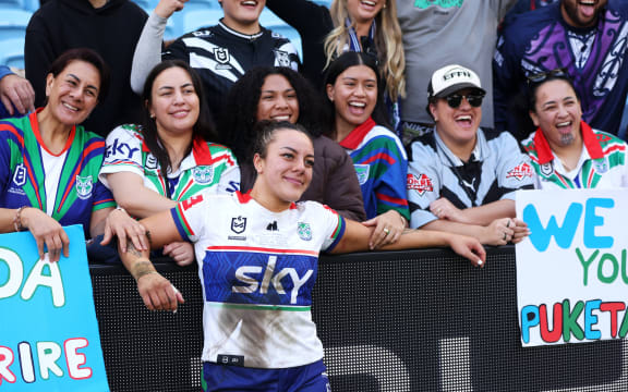 Marine Puketapu of the Warriors poses with with her supporters in the crowd after the Sydney Roosters Women v NZ Warriors Women.