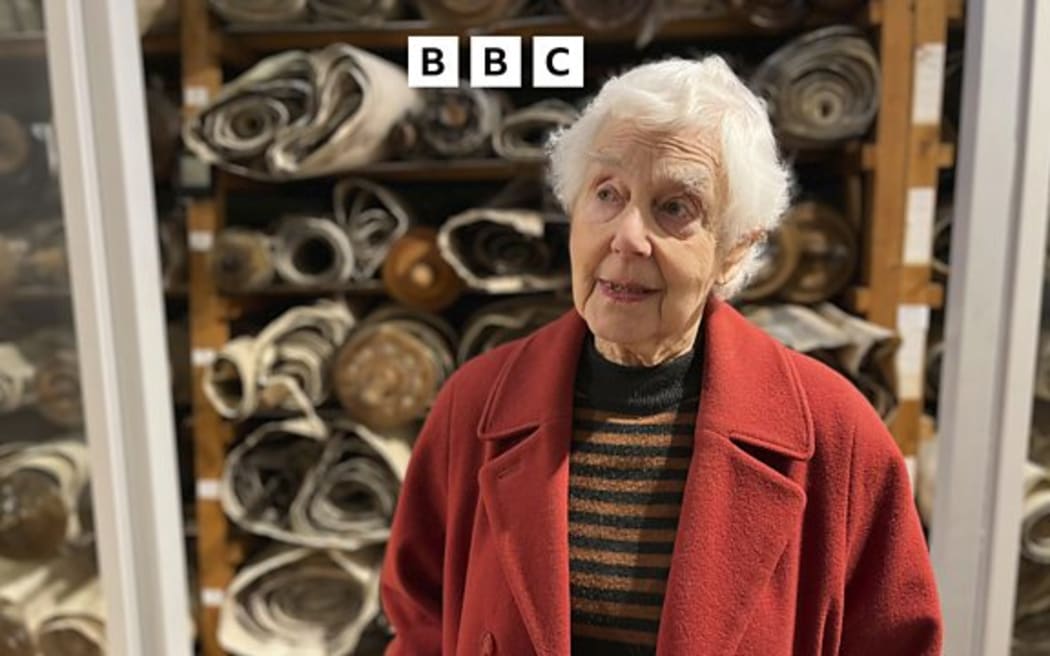 Philippa beside the scrolls in Westminster Synagogue