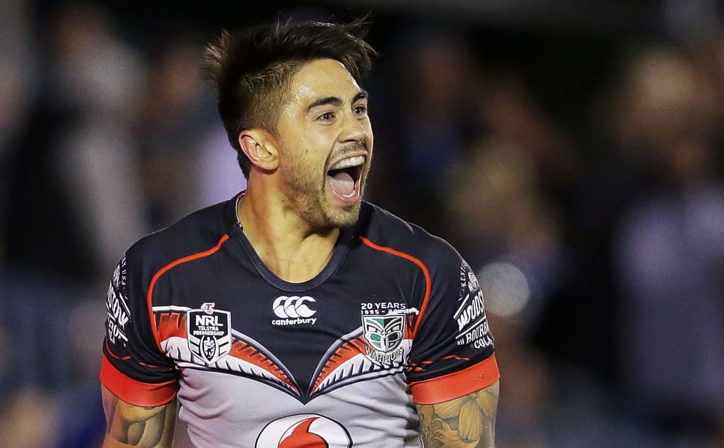 The Warriors halfback Shaun Johnson celebrates a try.