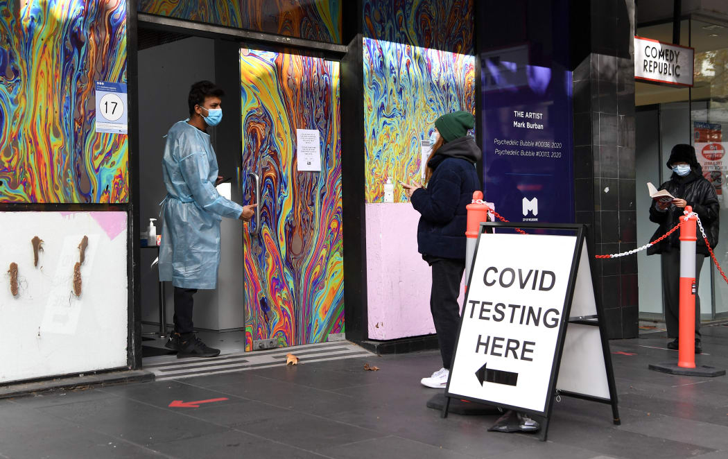 People wait in queues at a Covid-19 testing centre in Melbourne on 26 May 2021, as Australia's second biggest city scrambles to contain a growing Covid outbreak.