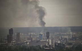 Smoke rises from the city of Sievierodonetsk on 13 June 2022, amid Russian invasion of Ukraine.