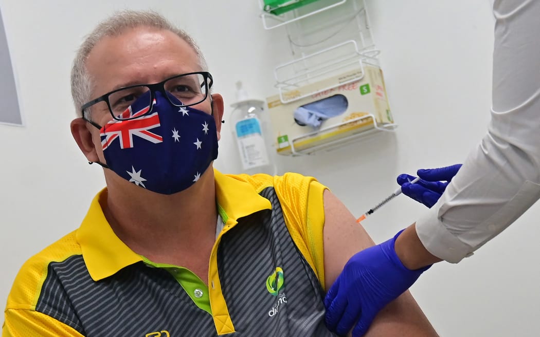 Australia's Prime Minister Scott Morrison receives a dose of the Pfizer/BioNTech Covid-19 vaccine.