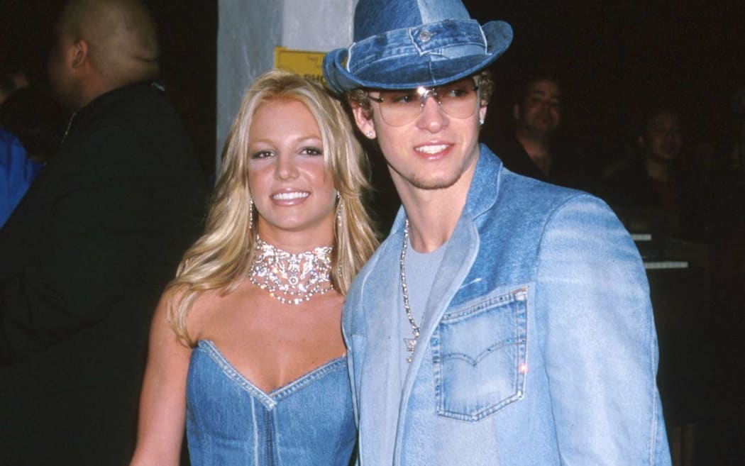 Britney Spears and Justin Timberlake attend the 2001 American Music Awards wearing coordinated double denim looks.
