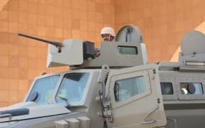 Saudi border guards stand guard in the closed al-Tuwal border crossing with Yemen in the southern Jizan province on October 3, 2017.