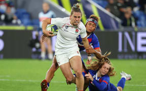Claudia MacDonald of England is tackled during the Pool C Rugby World Cup 2021 match between France and England at Northland Events Centre on October 15, 2022, in Whangarei, New Zealand. (Photo by Fiona Goodall - World Rugby/World Rugby via Getty Images)