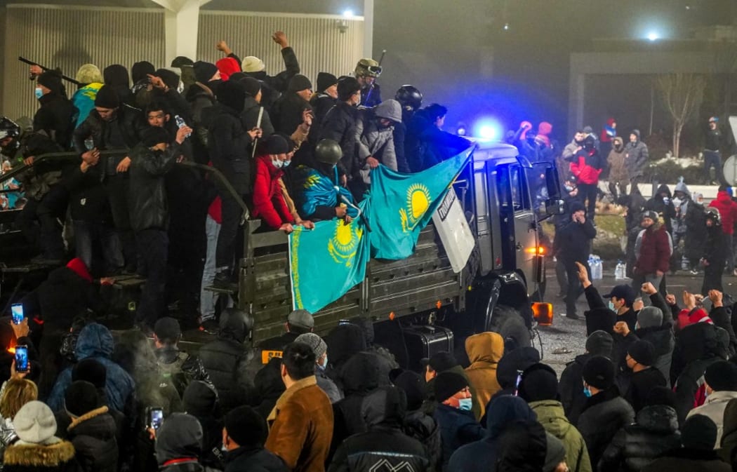 Protesters take part in a rally over a hike in energy prices in Almaty on January 5, 2022.