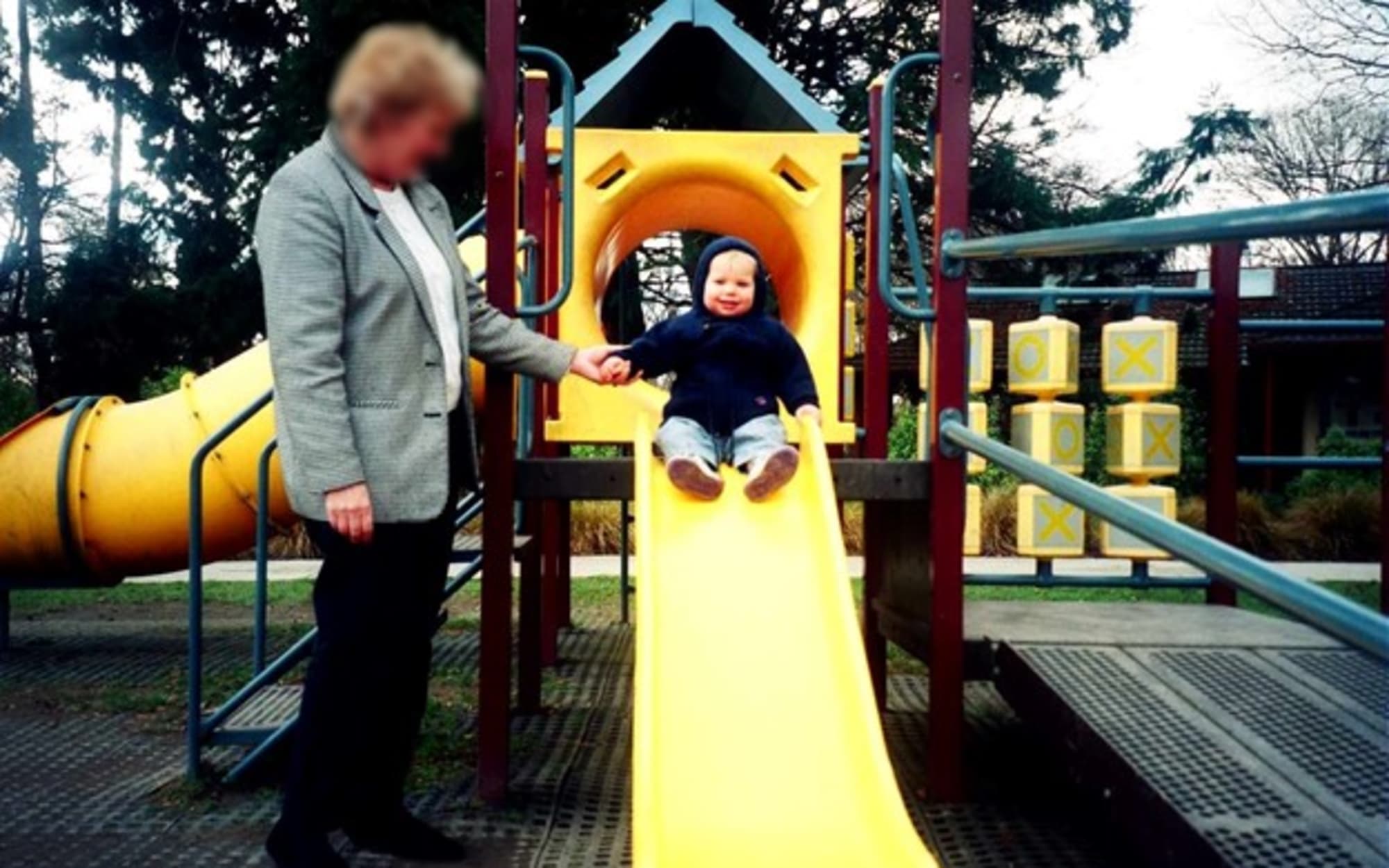 Katie Fitzgerald as a toddler enjoying the slide at Christchurch's Botanic Gardens.