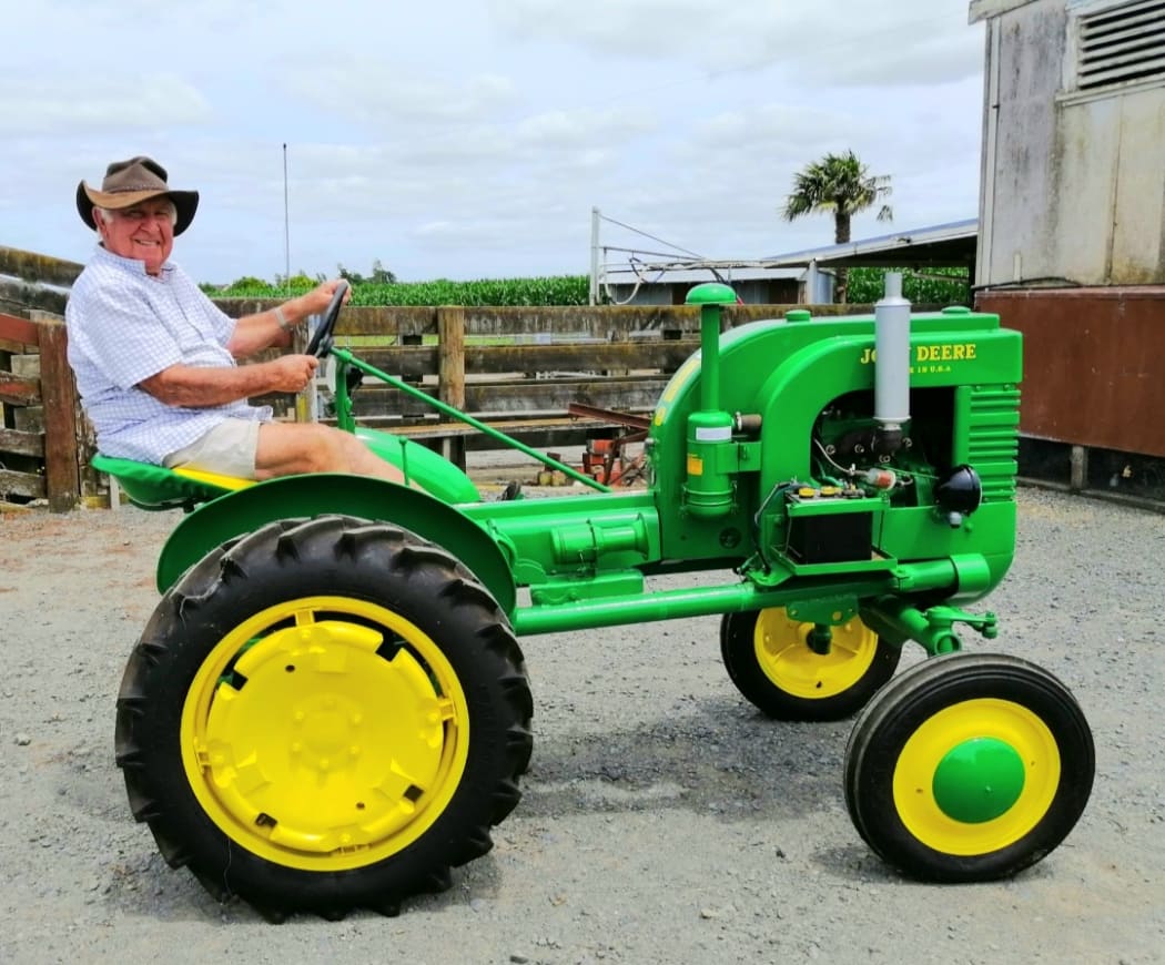 Waikato farmer Paul Devcich on one of his restored John Deere tractors