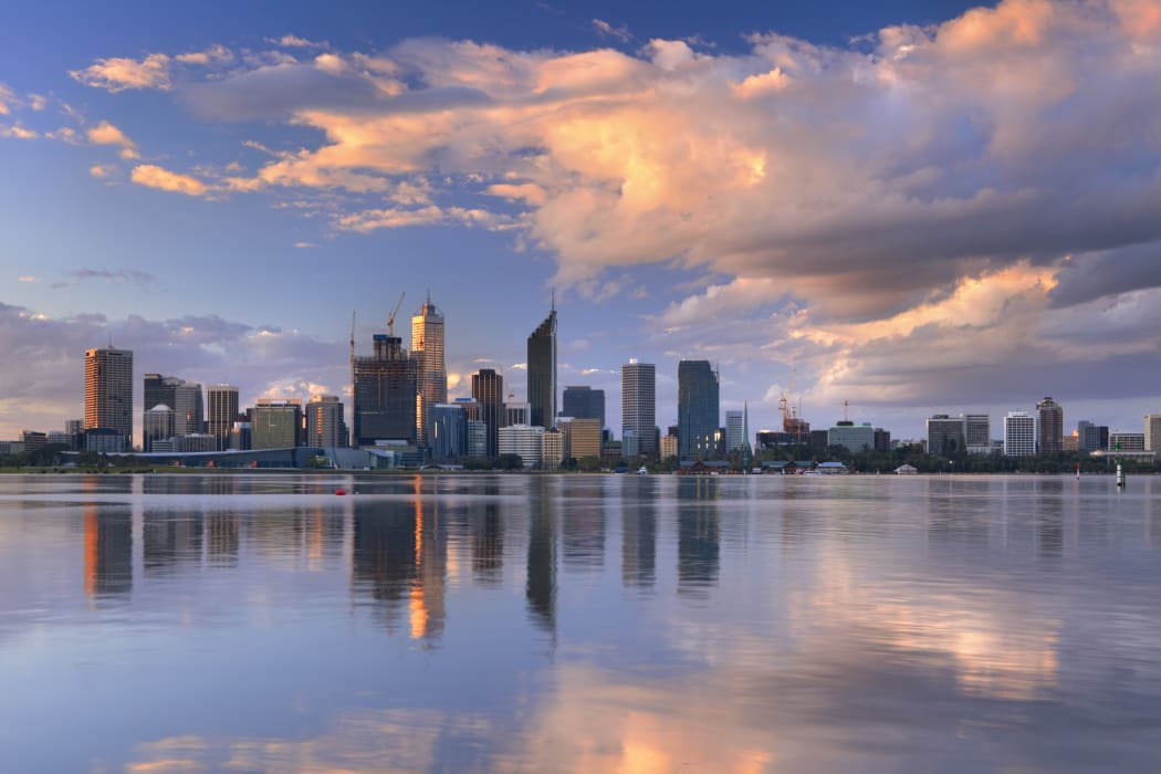 The skyline of Perth, Western Australia at sunset. Photographed from across the Swan River.