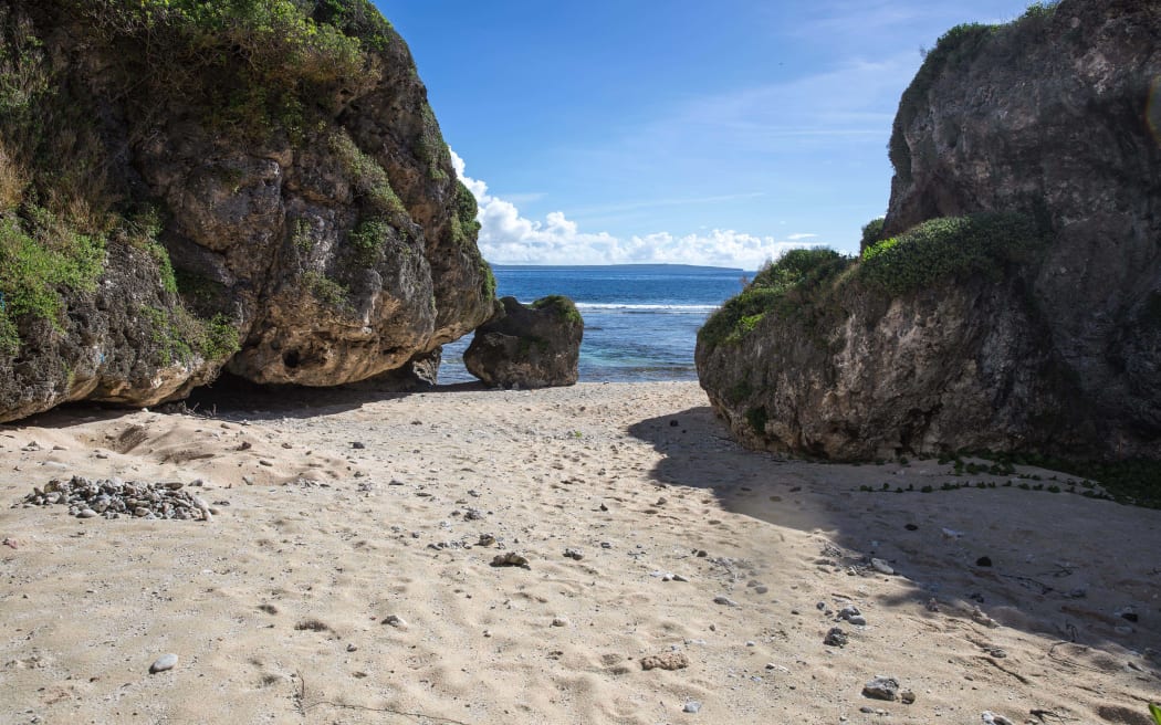 A beach in Tinian, CNMI, used for subsistence fishing and recreation by local residents.  Proposed US military live-fire training would prevent access to this beach much of the year. Saipan is visible just across the water.