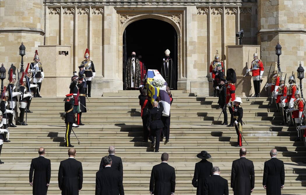 Pallbearers of the Royal Marines carrying the coffin up the West Steps into St George's Chapel.