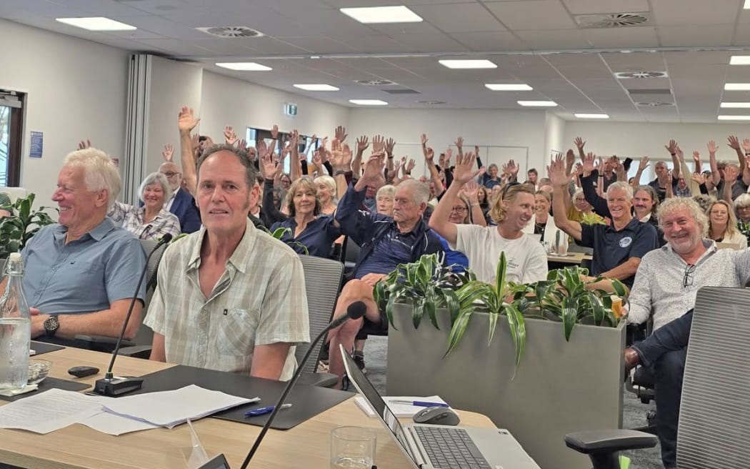 Hands up: Supporters of repairing the West End track were asked to raise their hands at a packed council chambers yesterday.