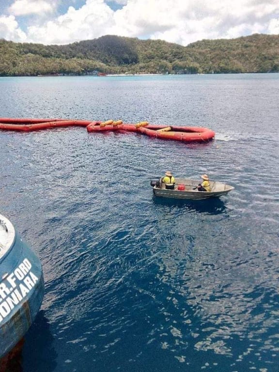 Clean up efforts after the oil spill off Rennell Island in Solomon Islands.