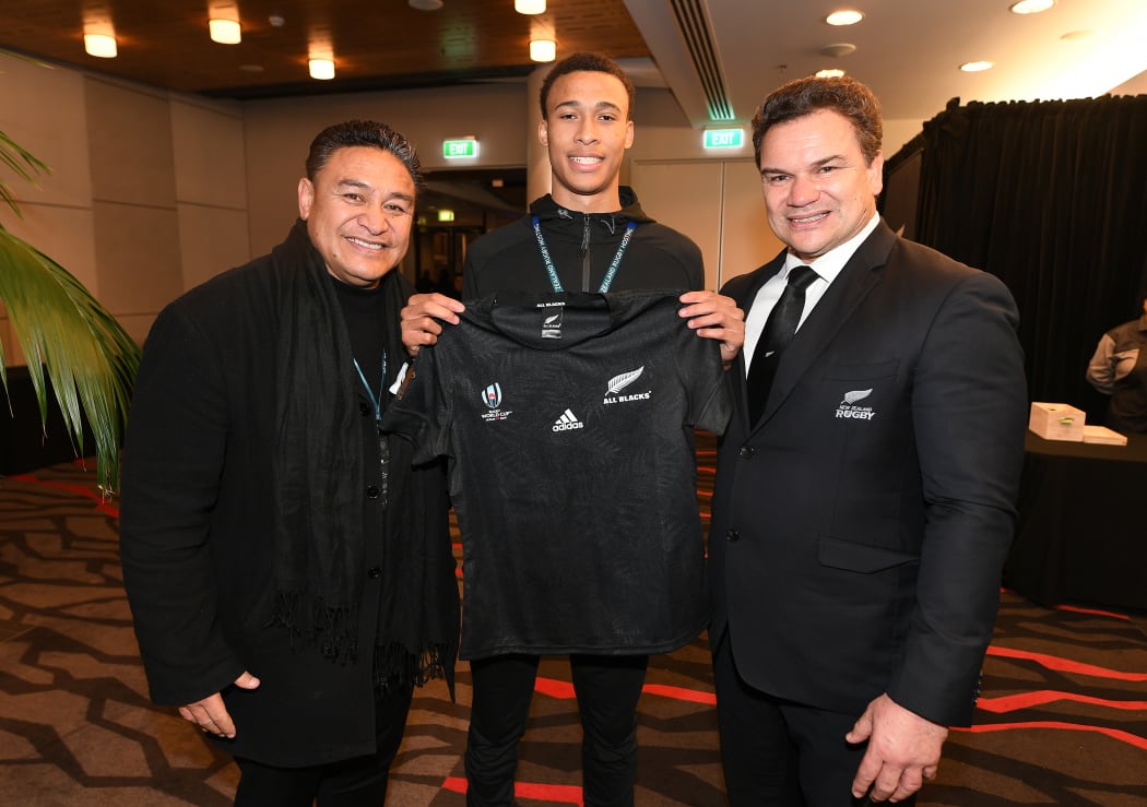 Eroni Clarke and former All Blacks teammate Michael Jones pose with former NZ Breakers basketball player RJ Hampton.