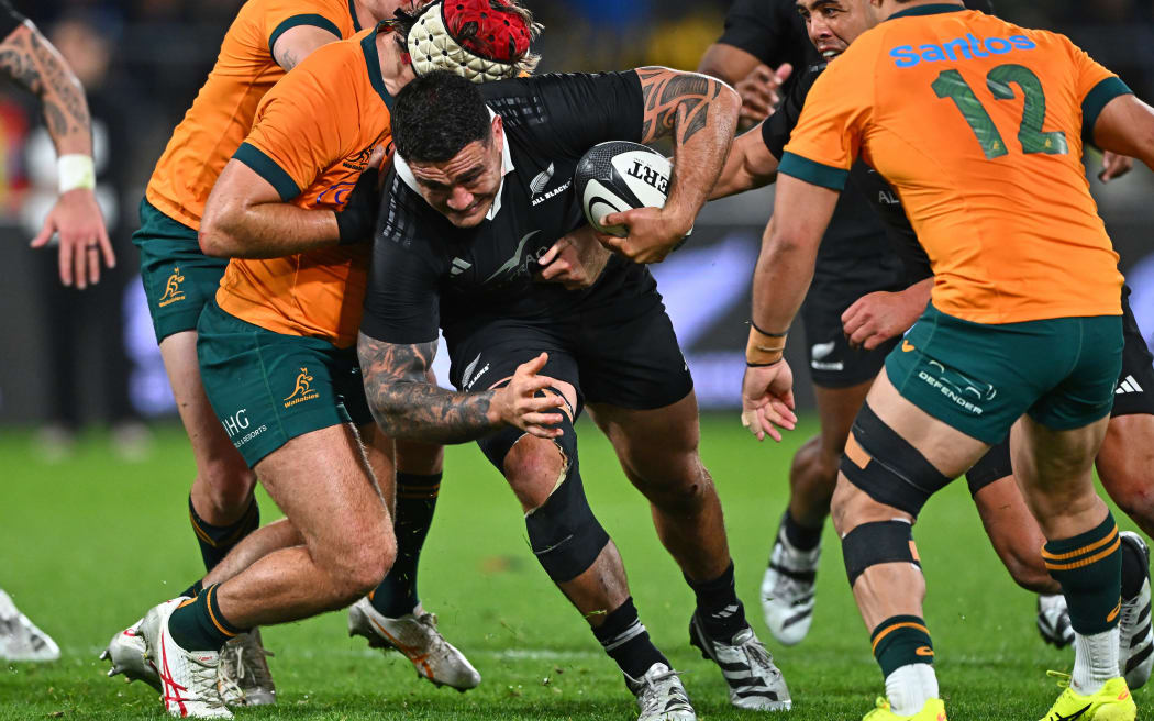 Codie Taylor is tackled.