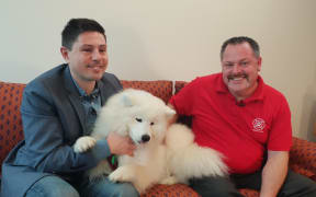 Green Mp Gareth Hughes, left, Steve Glassey, co-founder of Animal Evacuation NZ, and Luna.
