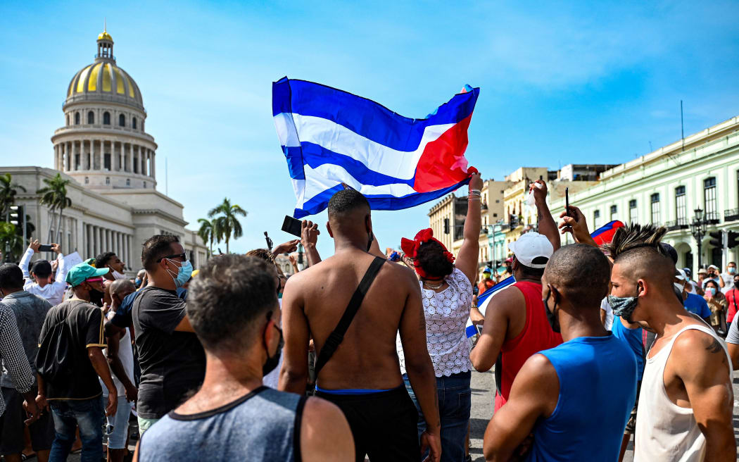 Cubans are seen outside Havana's Capitol during a demonstration against the government of Cuban President Miguel Diaz-Canel in Havana, on July 11, 2021.