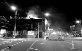 Emergency responders at Loafers Lodge in black and white