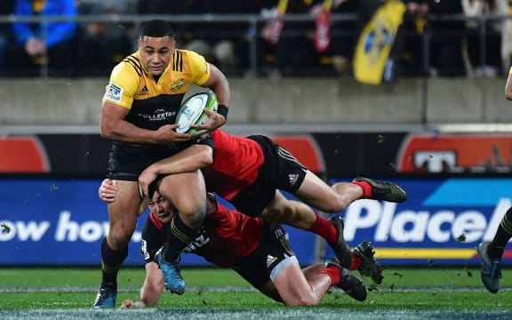 Hurricane Ngani Laumape takes on the Crusaders' line.