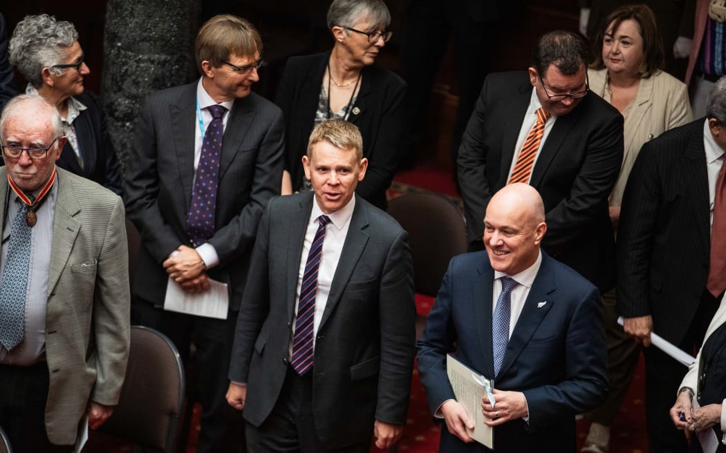 Opposition leader Chris Hipkins and Prime Minister Christopher Luxon arrive to hear the Speech from the Throne.