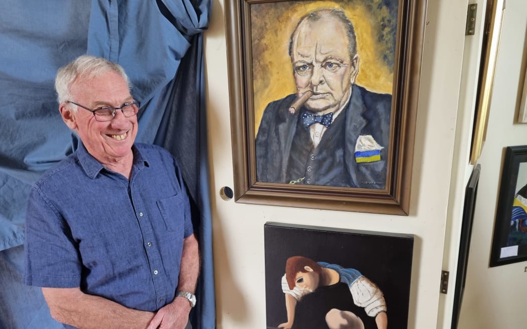 Graham Christensen presents one of his works, below, watched over by Winston Churchill, as drawn by another Fakes and Forgeries entrant.
