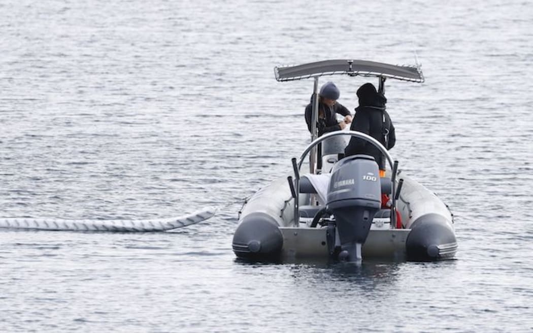 Efforts to recover a submerged vehicle in Lake Rotoma.