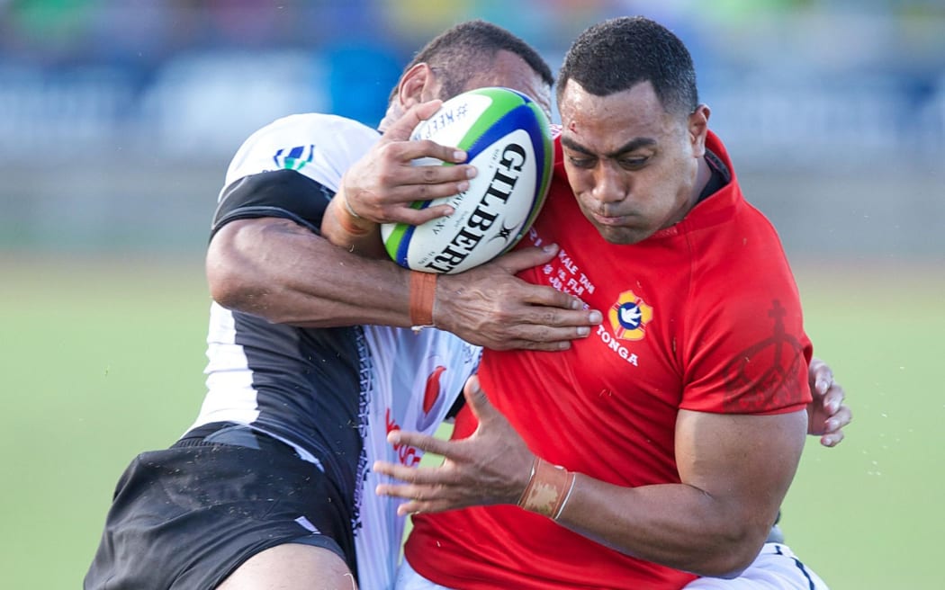 Tonga midfielder Sione Piukala in action against Fiji.