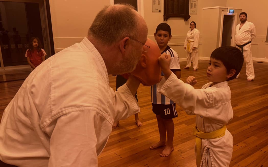 Stephen Hilson, left, spars with a young member at NZ Disability Karate Association in Khandallah